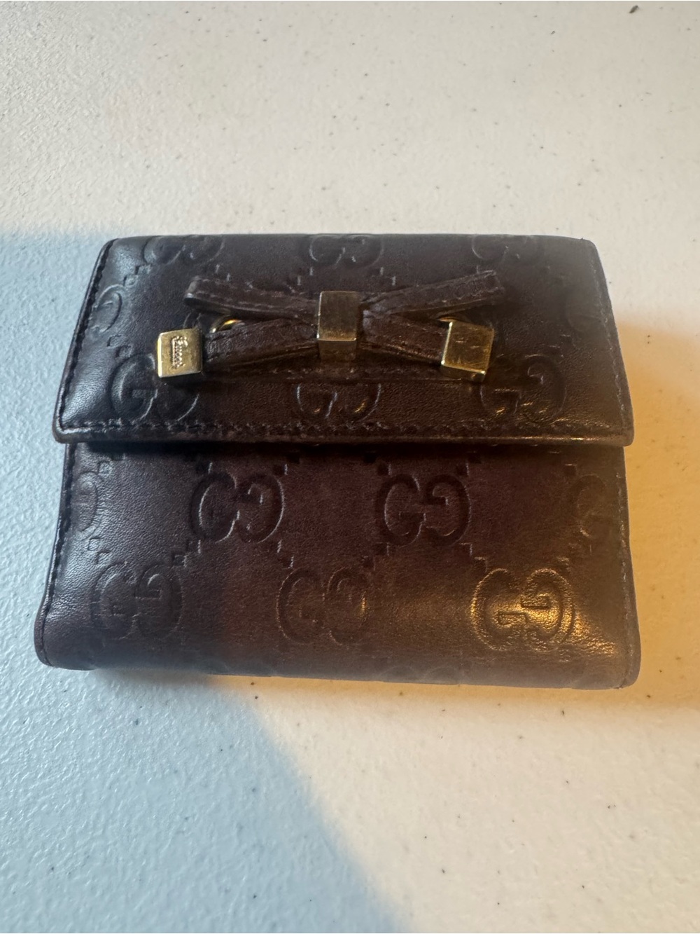 Gucci Dark Brown Embossed GG Leather Bow Clasp Wallet